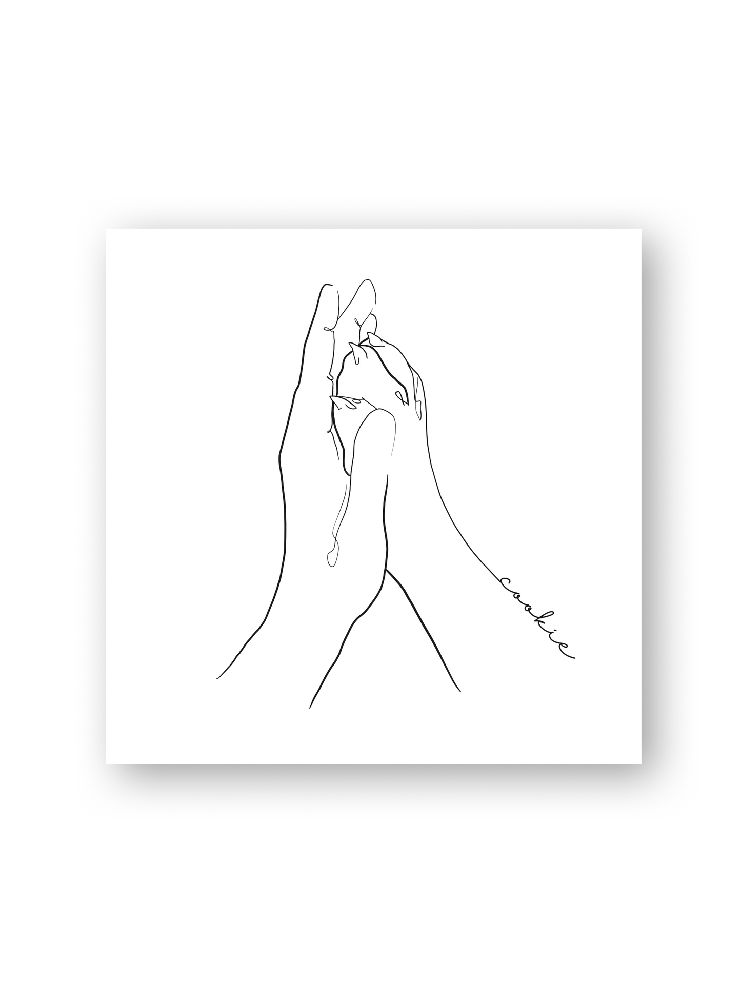 Line-Art-Poster mit dem Titel 'Patita'. Das Kunstwerk zeigt eine Hand, die eine kleine Hundepfote hält, in minimalistischer Ausführung. Die feinen Linien sind elegant und klar, und das Design hebt sich auf einem weißen Hintergrund hervor.